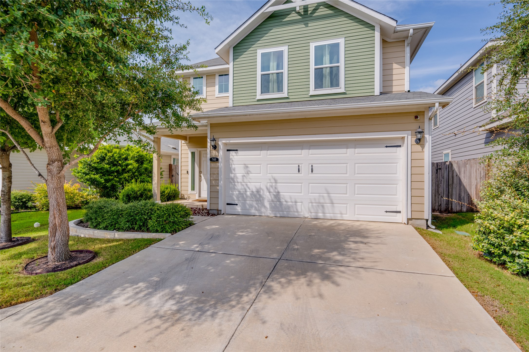 7948 Castelardo Place Round Rock, TX 78665 - Photo 5 of 32 a front view of a house with a yard and garage