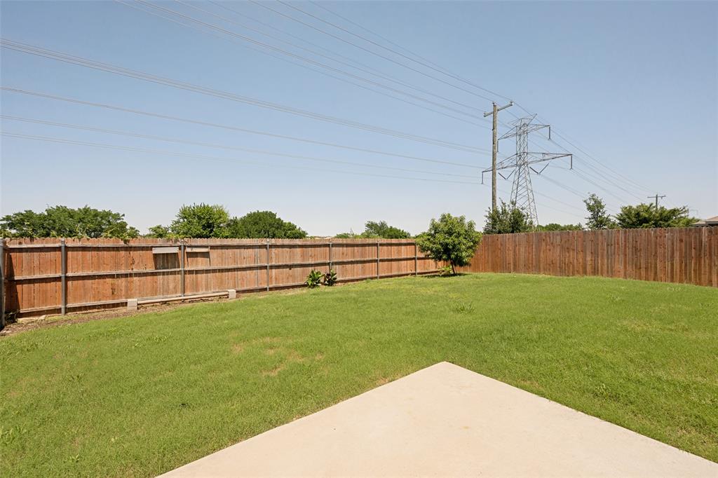 857 Watson Way Crowley, TX 76036 - Photo 25 of 25 Spacious backyard featuring a concrete patio, wood privacy fencing, and a grassy lawn