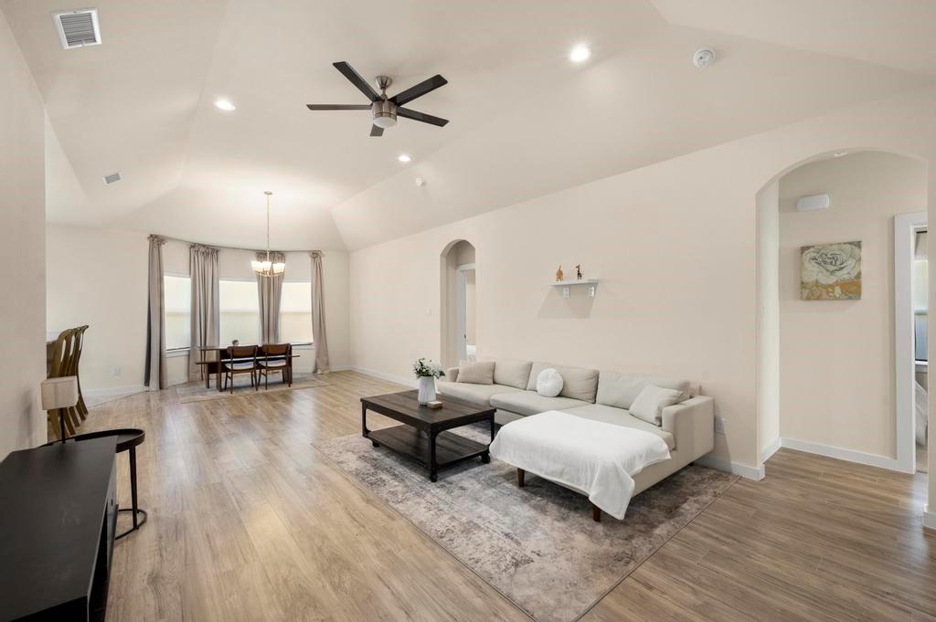 2815 East Overton Road Dallas, TX 75216 - Photo 11 of 23 a living room with furniture and wooden floor