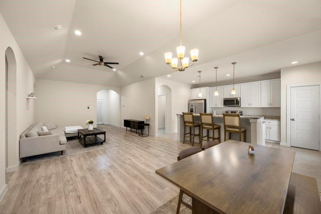 2815 East Overton Road Dallas, TX 75216 - Photo 15 of 23 a large kitchen with a table and chairs