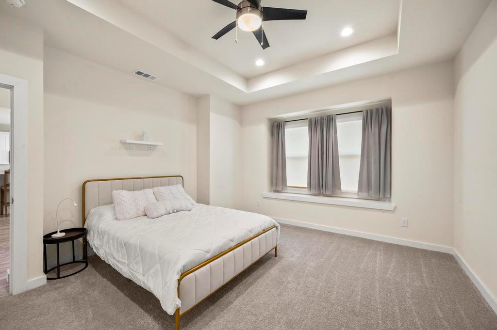 2815 East Overton Road Dallas, TX 75216 - Photo 7 of 23 a bedroom with a bed and window