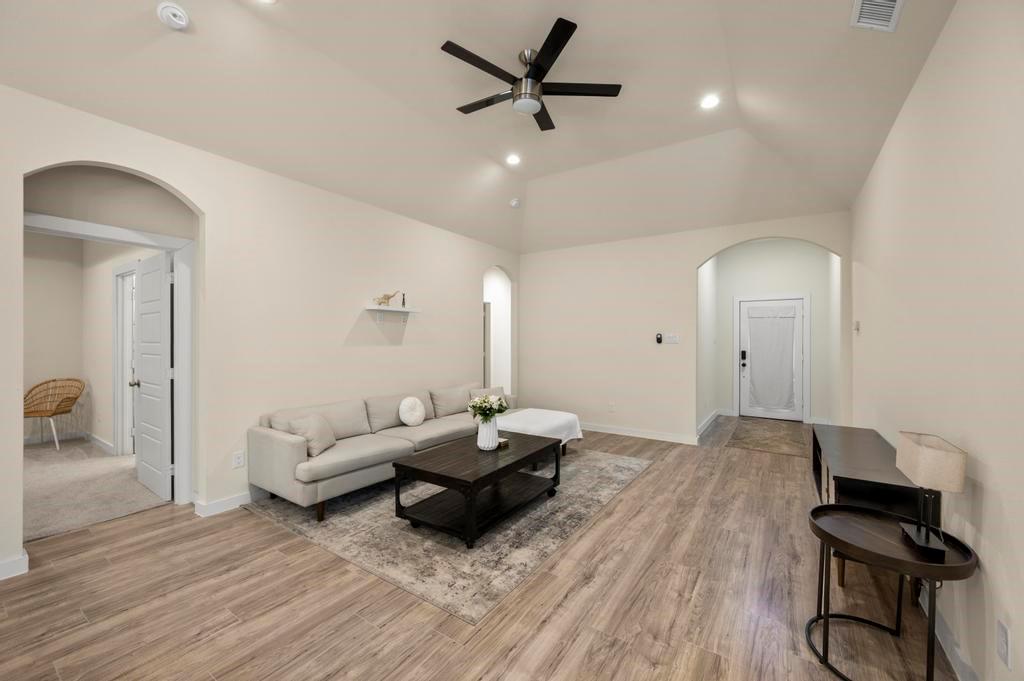 2815 East Overton Road Dallas, TX 75216 - Photo 10 of 23 a living room with furniture and a wooden floor