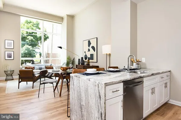 a view of kitchen with sink and living room