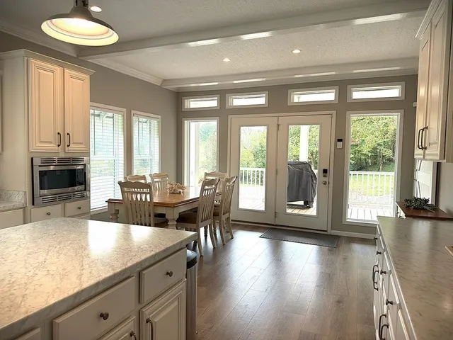 a kitchen with stainless steel appliances a refrigerator and a sink