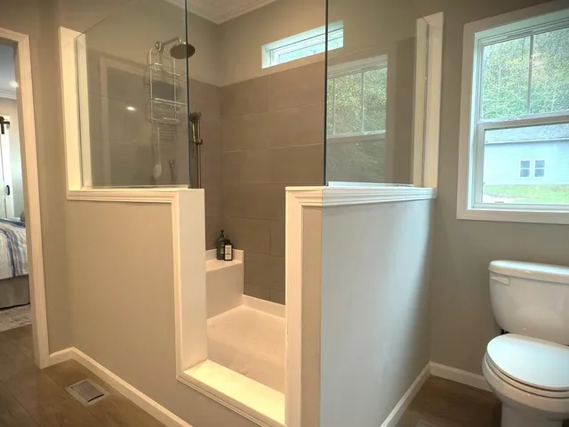a en suite bathroom with a sink and a mirror