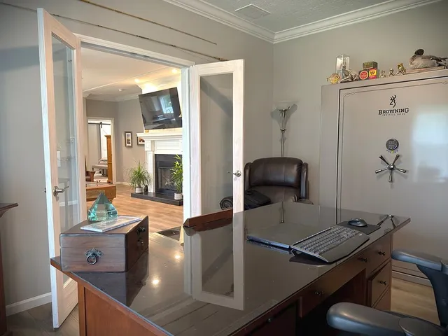 a view of swimming pool with trees and yard in front of it