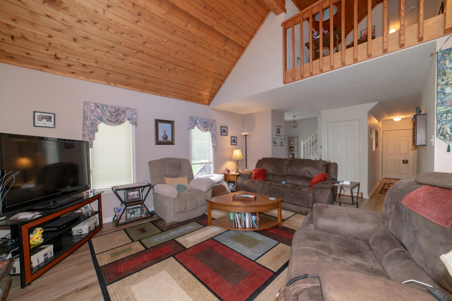 8796 Roanoke Road Elliston, VA 24087 - Photo 11 of 40 a living room with furniture and a flat screen tv