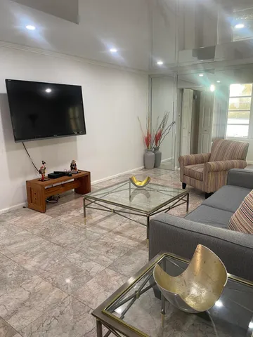 a bathroom with a sink vanity and mirror