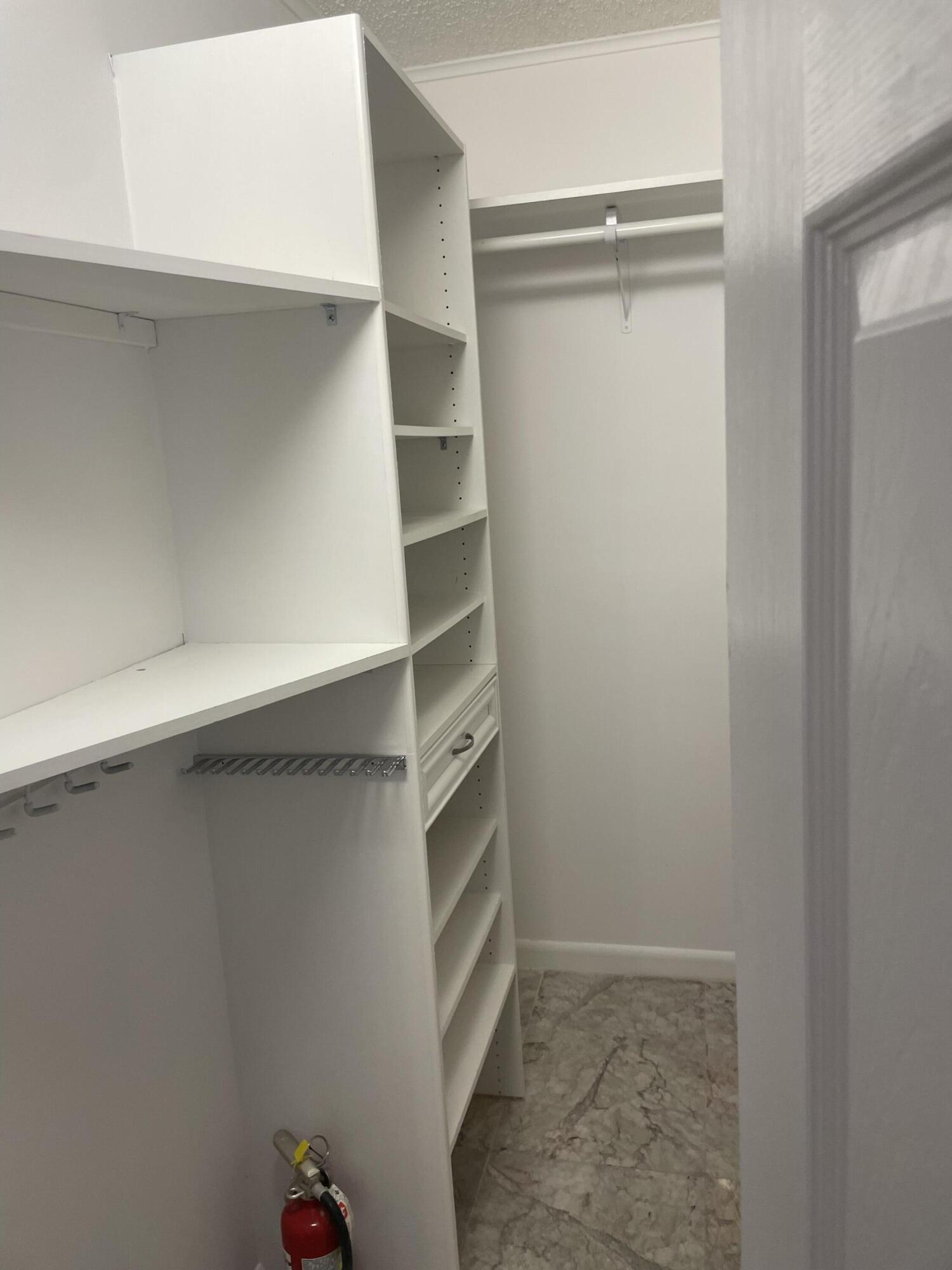 1904 Bermuda Circle, Unit H1 Coconut Creek, FL 33066 - Photo 36 of 72 a view of an empty walk in closet