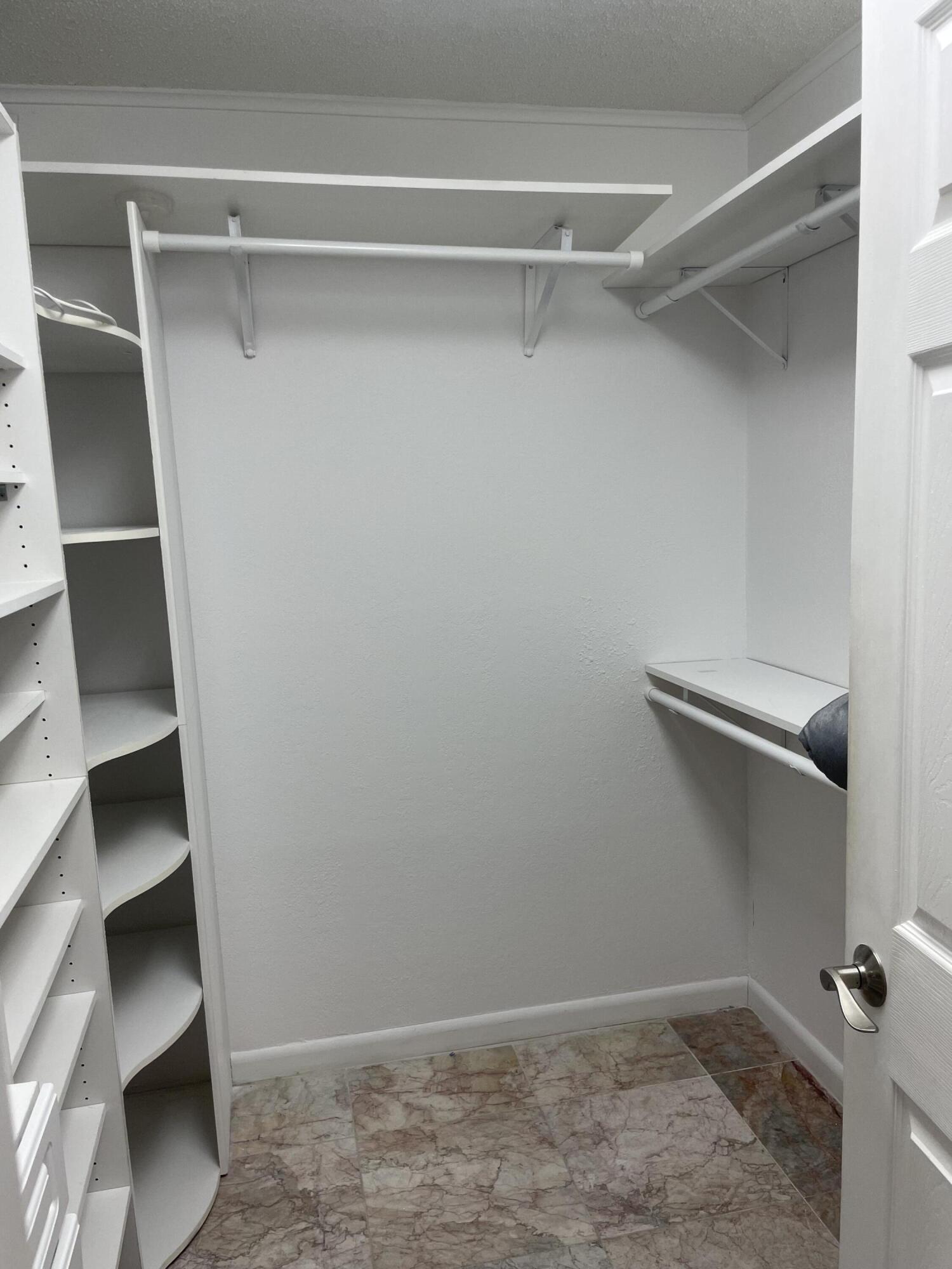 1904 Bermuda Circle, Unit H1 Coconut Creek, FL 33066 - Photo 37 of 72 a view of an empty walk in closet