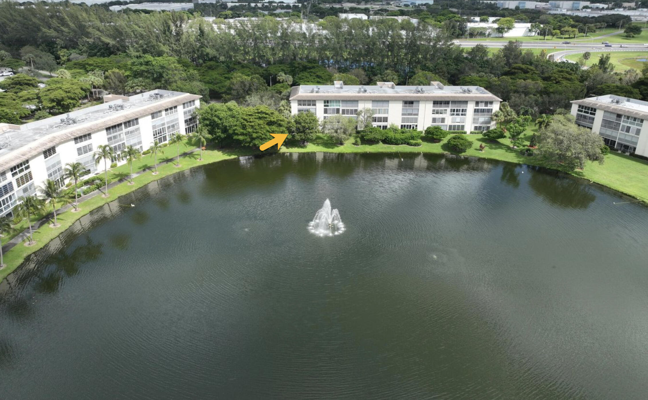 1904 Bermuda Circle, Unit H1 Coconut Creek, FL 33066 - Photo 47 of 72 View from the lake with arrow