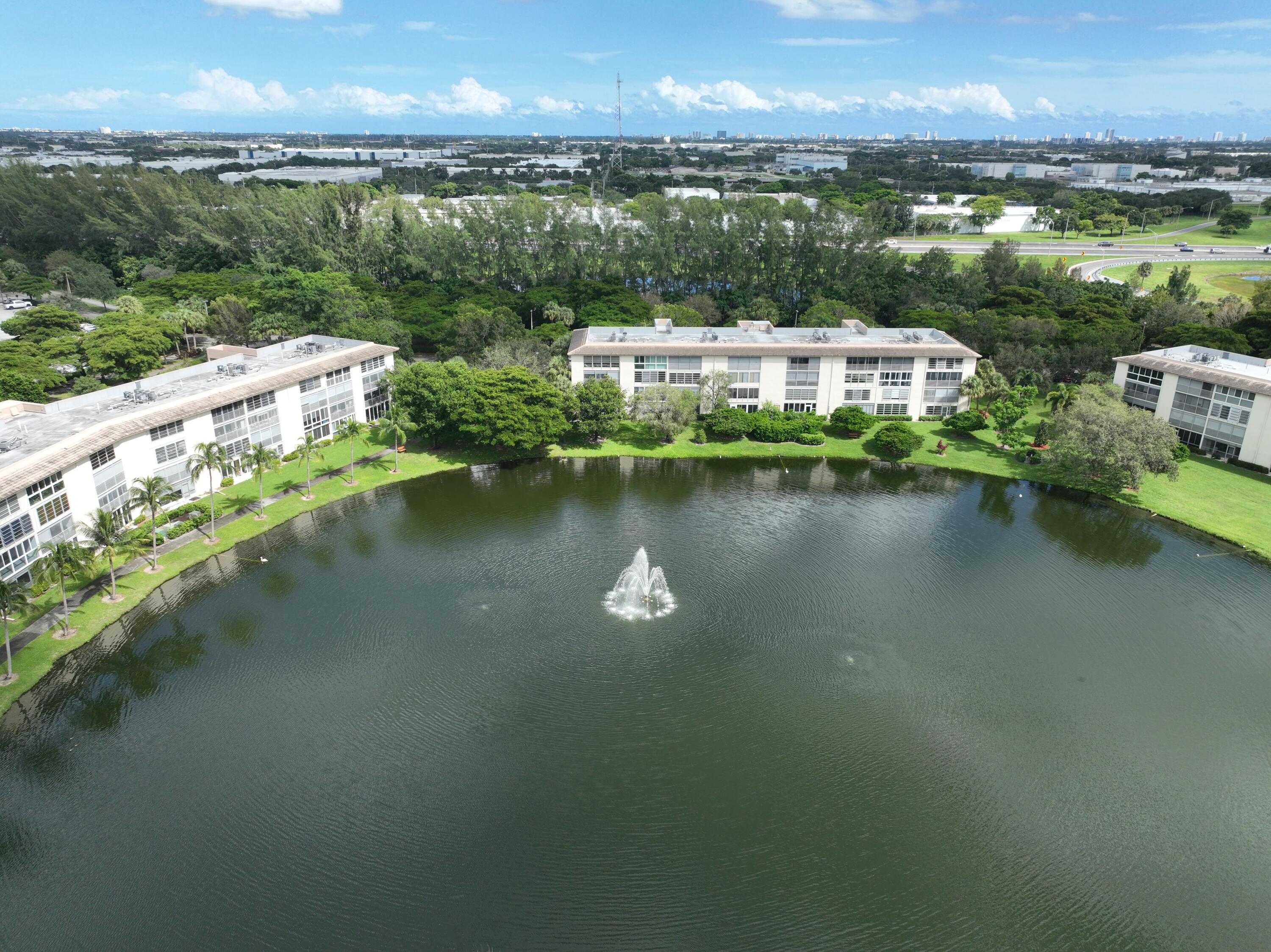 1904 Bermuda Circle, Unit H1 Coconut Creek, FL 33066 - Photo 48 of 72 an aerial view of a house with a lake view