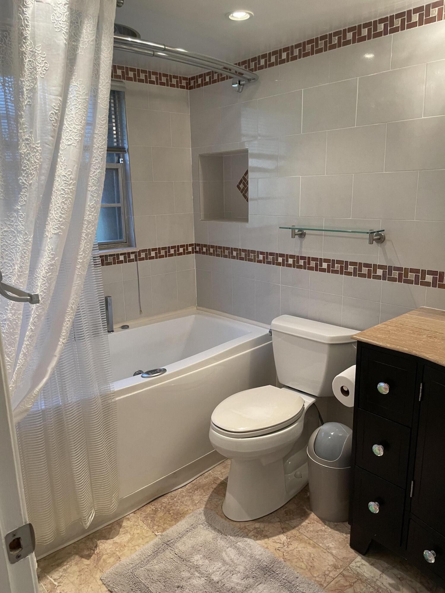 1904 Bermuda Circle, Unit H1 Coconut Creek, FL 33066 - Photo 6 of 72 a bathroom with a toilet a sink and bathtub