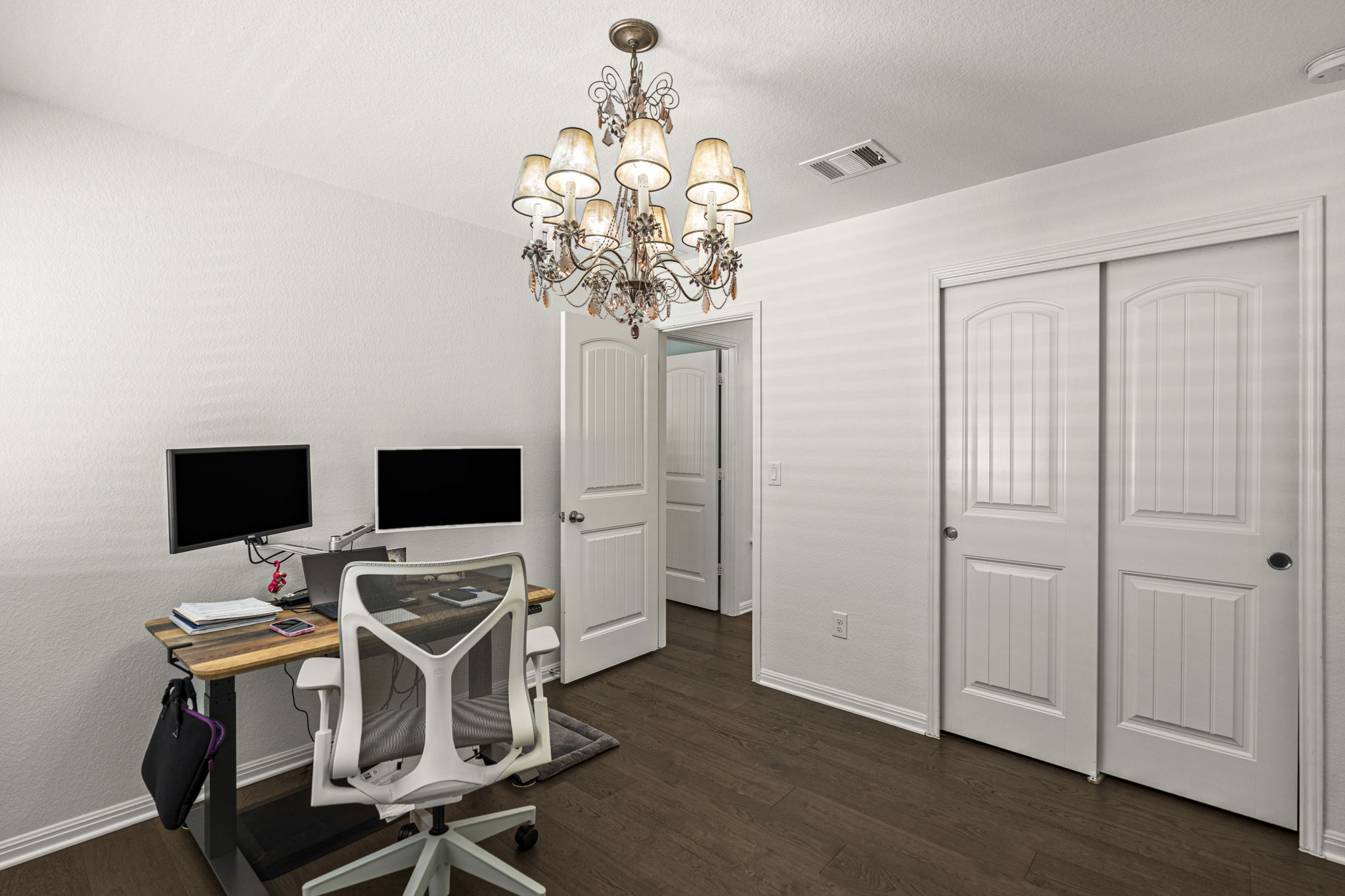 11412 Reading Way Austin, TX 78717 - Photo 20 of 35 Upstairs bedroom with wood flooring.