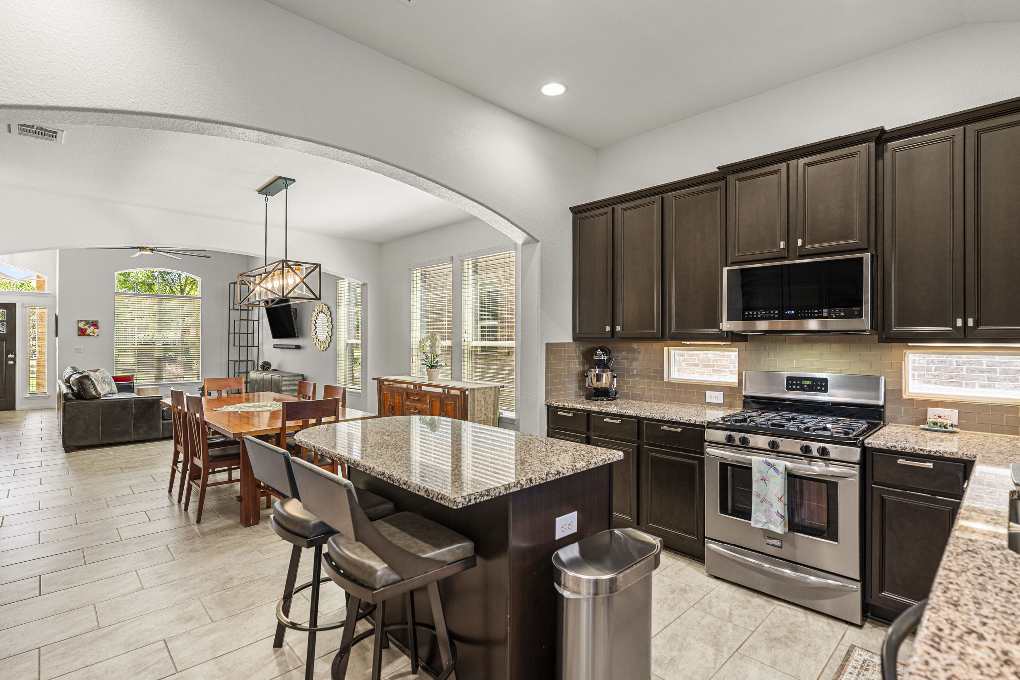 11412 Reading Way Austin, TX 78717 - Photo 8 of 35 Eat in kitchen featuring stainless steel appliances and granite countertops.