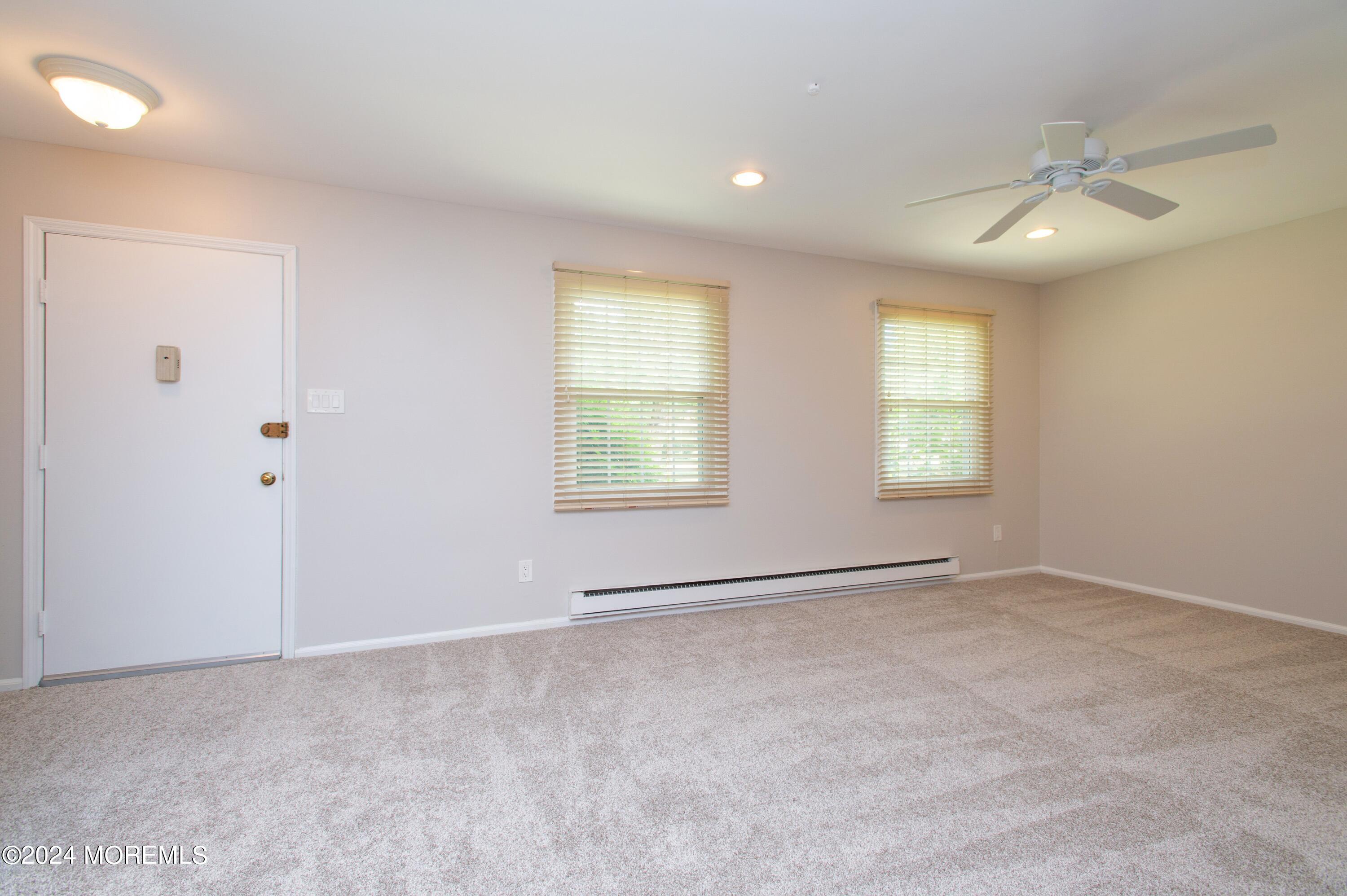 95 Halls Croft Road, Unit E Freehold, NJ 07728 - Photo 3 of 23 03_95HallsCroftRd_UnitE_1_LivingRoom_HiR