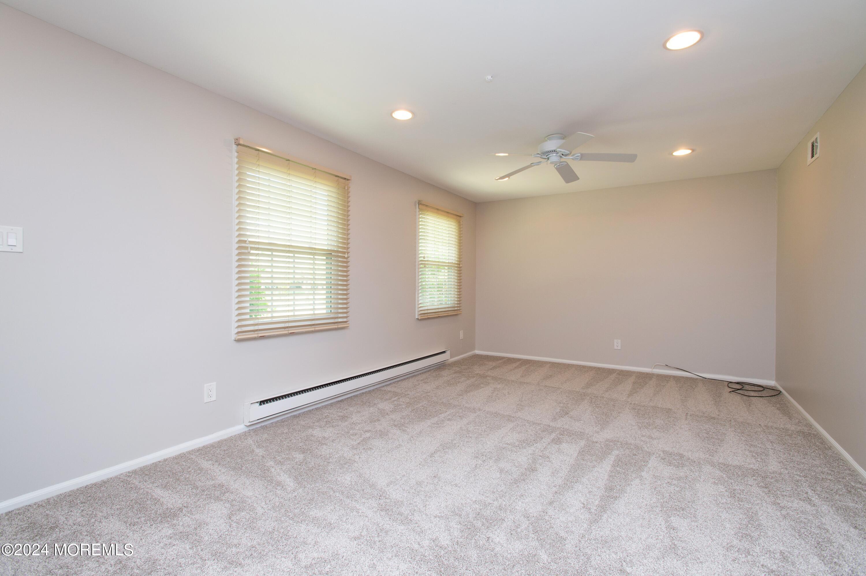 95 Halls Croft Road, Unit E Freehold, NJ 07728 - Photo 4 of 23 04_95HallsCroftRd_UnitE_165_LivingRoom_
