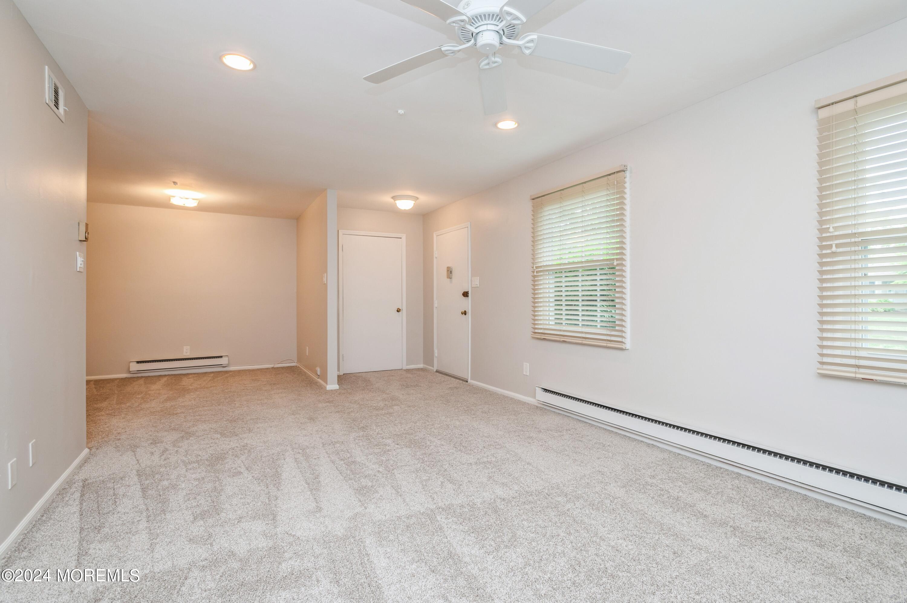 95 Halls Croft Road, Unit E Freehold, NJ 07728 - Photo 9 of 23 07_95HallsCroftRd_UnitE_10003_LivingRoom