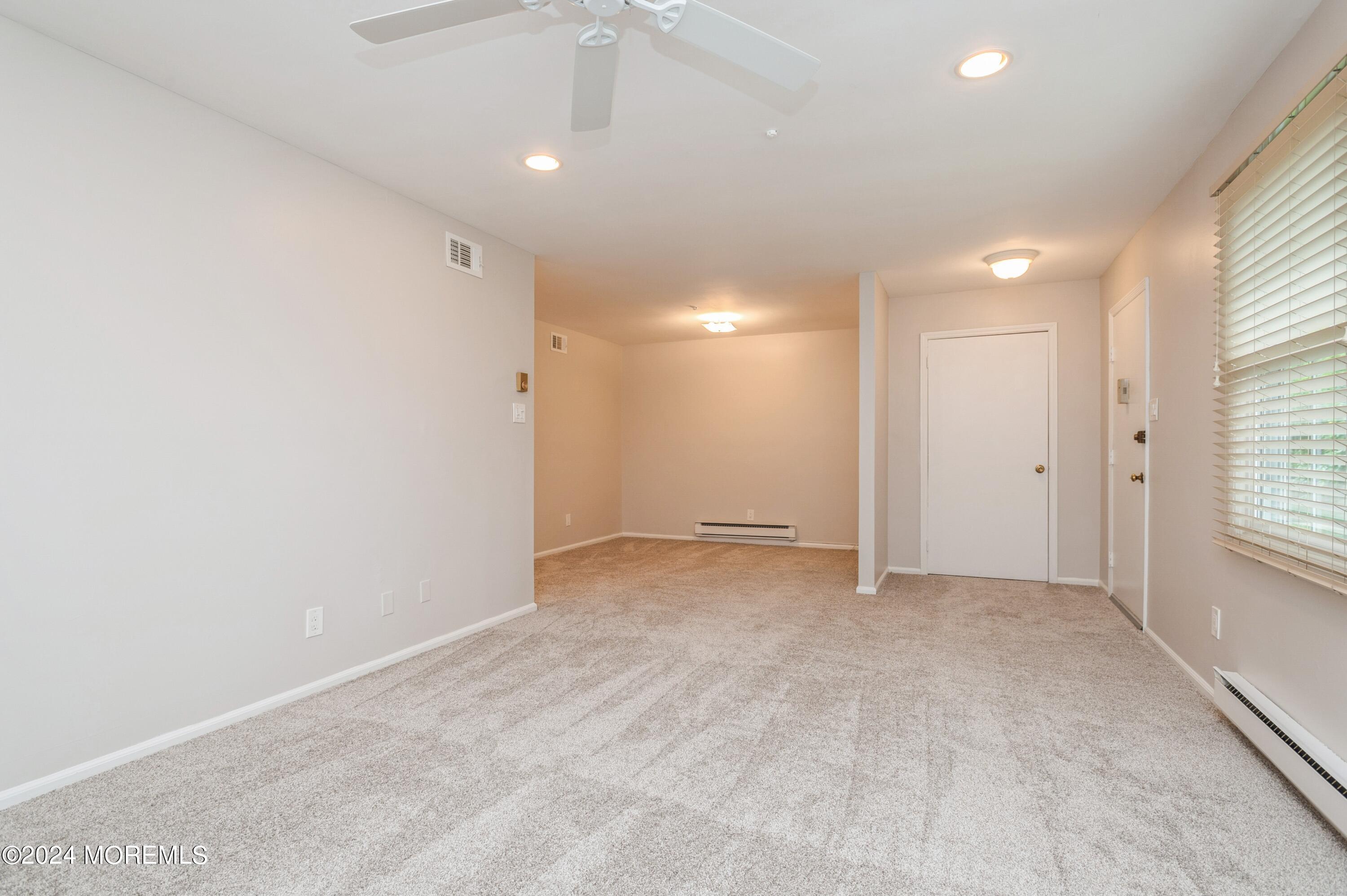 95 Halls Croft Road, Unit E Freehold, NJ 07728 - Photo 10 of 23 06_95HallsCroftRd_UnitE_10002_LivingRoom
