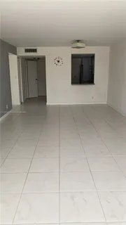 an aerial view of a house with a street