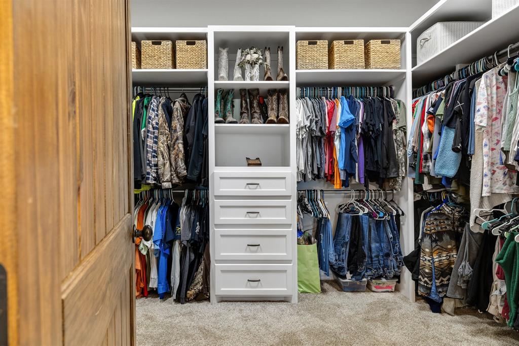 2668 Upper Montague Road Bowie, TX 76230 - Photo 15 of 40 a view of walk in closet with clothes and shoes