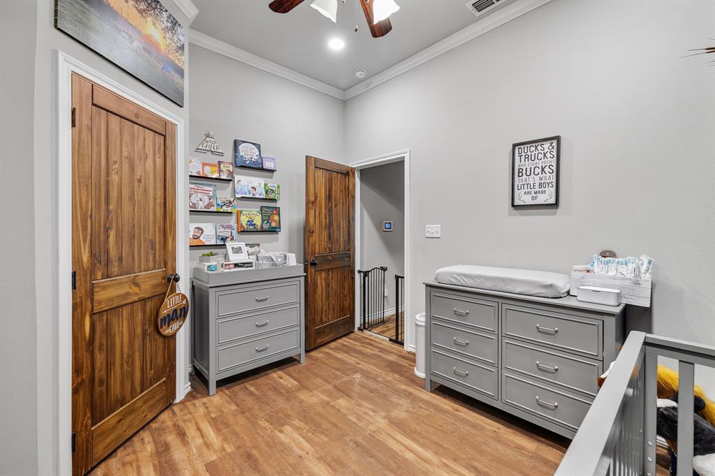 2668 Upper Montague Road Bowie, TX 76230 - Photo 17 of 40 a room with a dresser and a window