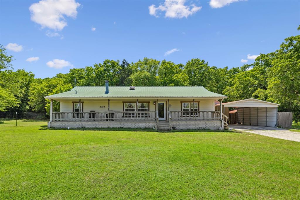 2668 Upper Montague Road Bowie, TX 76230 - Photo 22 of 40 a view of a house with a yard balcony and sitting area