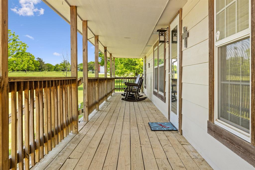 2668 Upper Montague Road Bowie, TX 76230 - Photo 23 of 40 a view of balcony with wooden floor and outdoor space