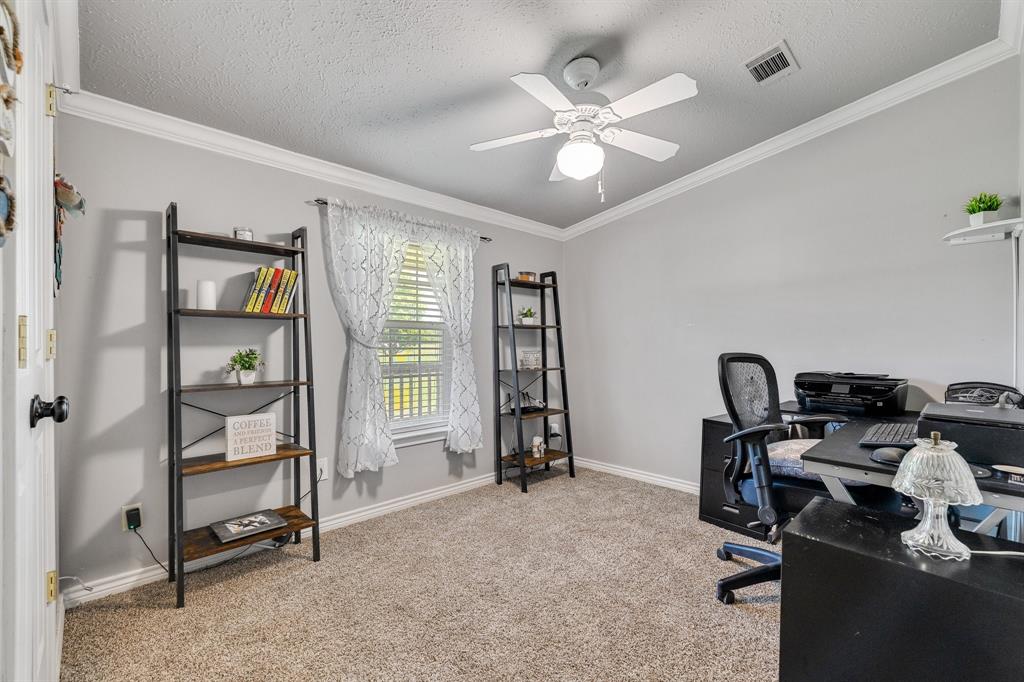 2668 Upper Montague Road Bowie, TX 76230 - Photo 30 of 40 a view of a workspace with furniture and a window