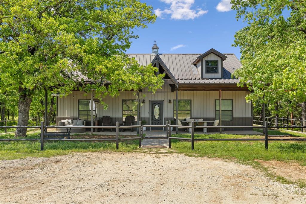 2668 Upper Montague Road Bowie, TX 76230 - Photo 3 of 40 a front view of a house with a yard