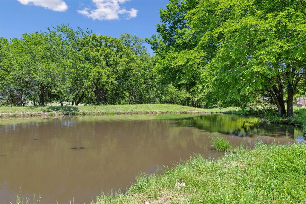 2668 Upper Montague Road Bowie, TX 76230 - Photo 34 of 40 a view of a lake in a garden