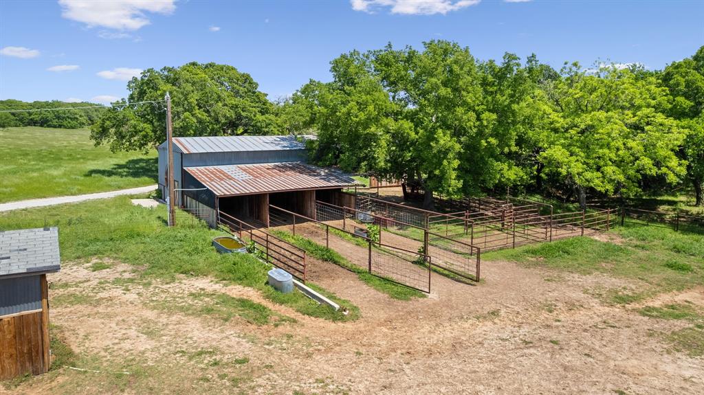 2668 Upper Montague Road Bowie, TX 76230 - Photo 39 of 40 a view of a backyard with wooden fence