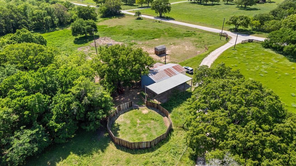 2668 Upper Montague Road Bowie, TX 76230 - Photo 40 of 40 a view of a swimming pool with a yard and green space