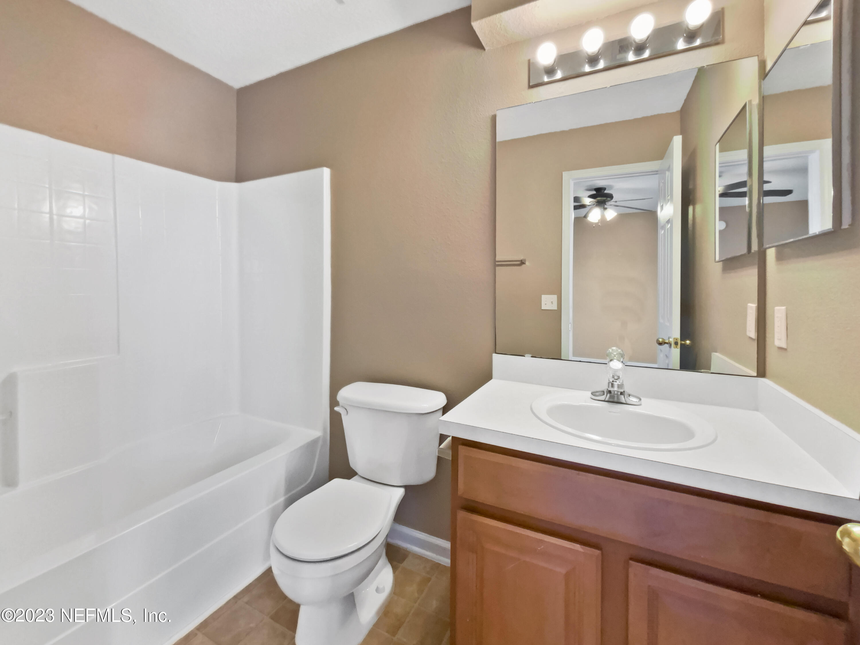 763 Scrub Jay Drive St. Augustine, FL 32092 - Photo 13 of 28 a bathroom with a sink toilet and shower