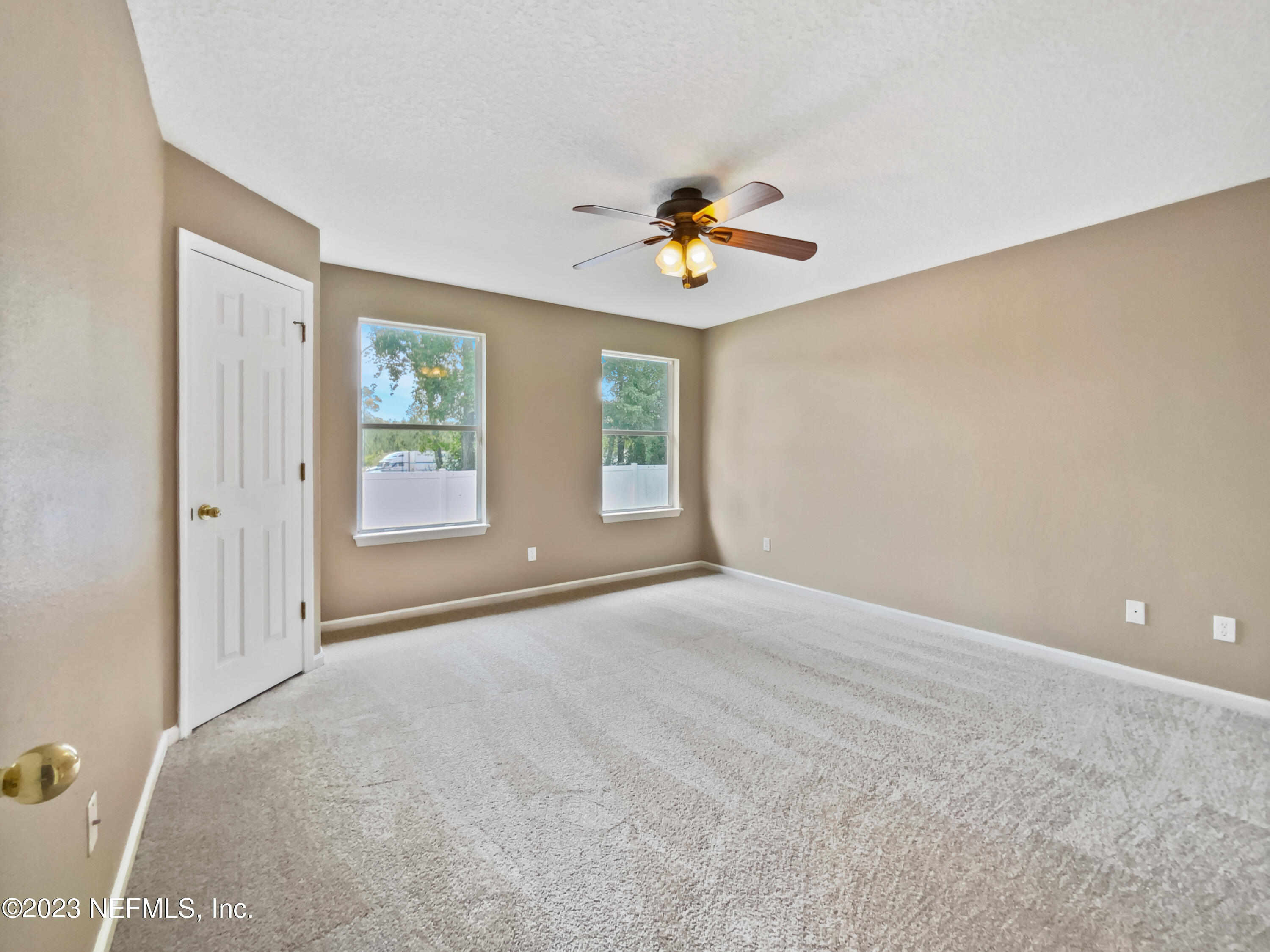 763 Scrub Jay Drive St. Augustine, FL 32092 - Photo 14 of 28 a view of an empty room with a window