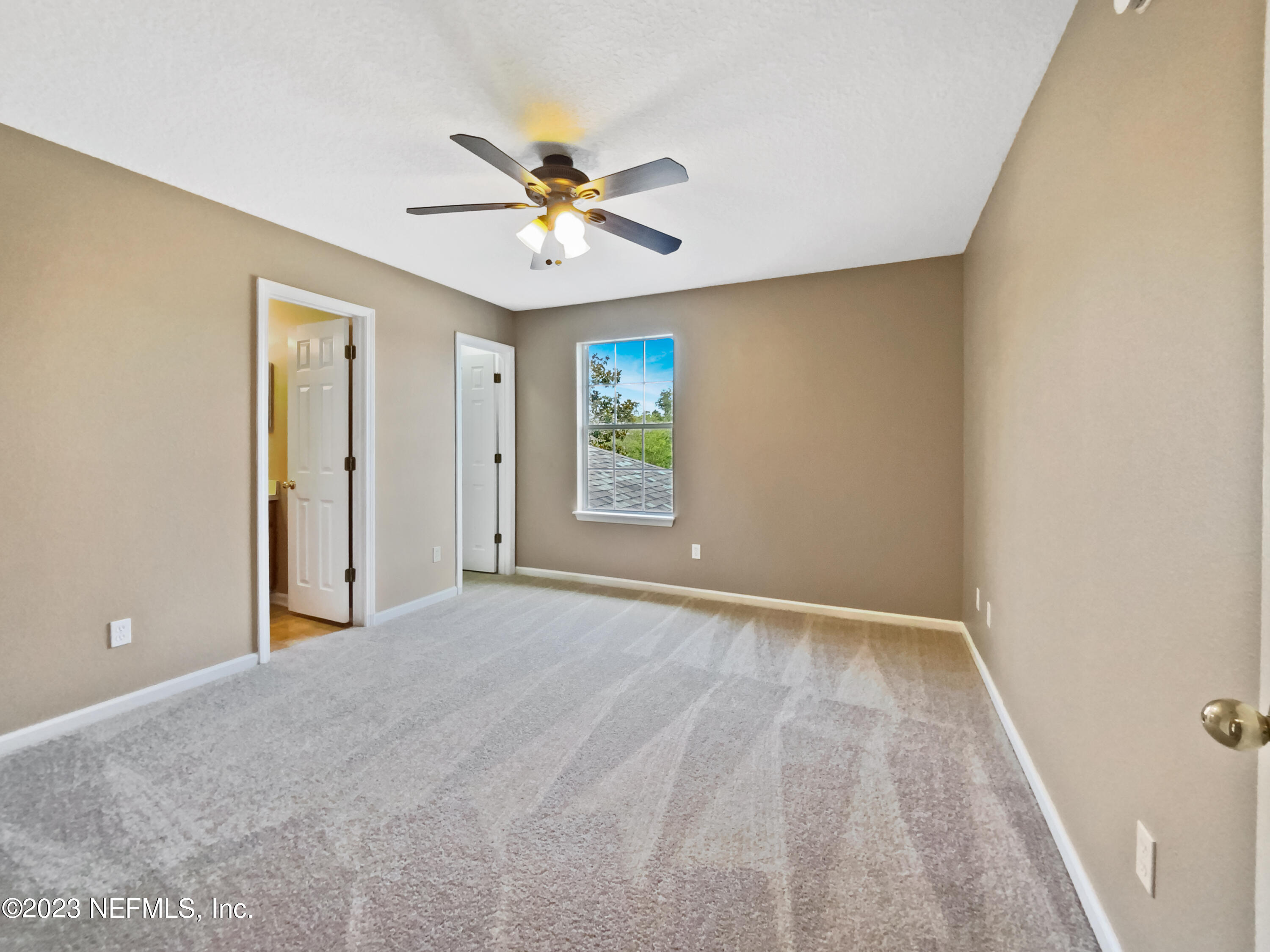 763 Scrub Jay Drive St. Augustine, FL 32092 - Photo 22 of 28 a view of an empty room with a window