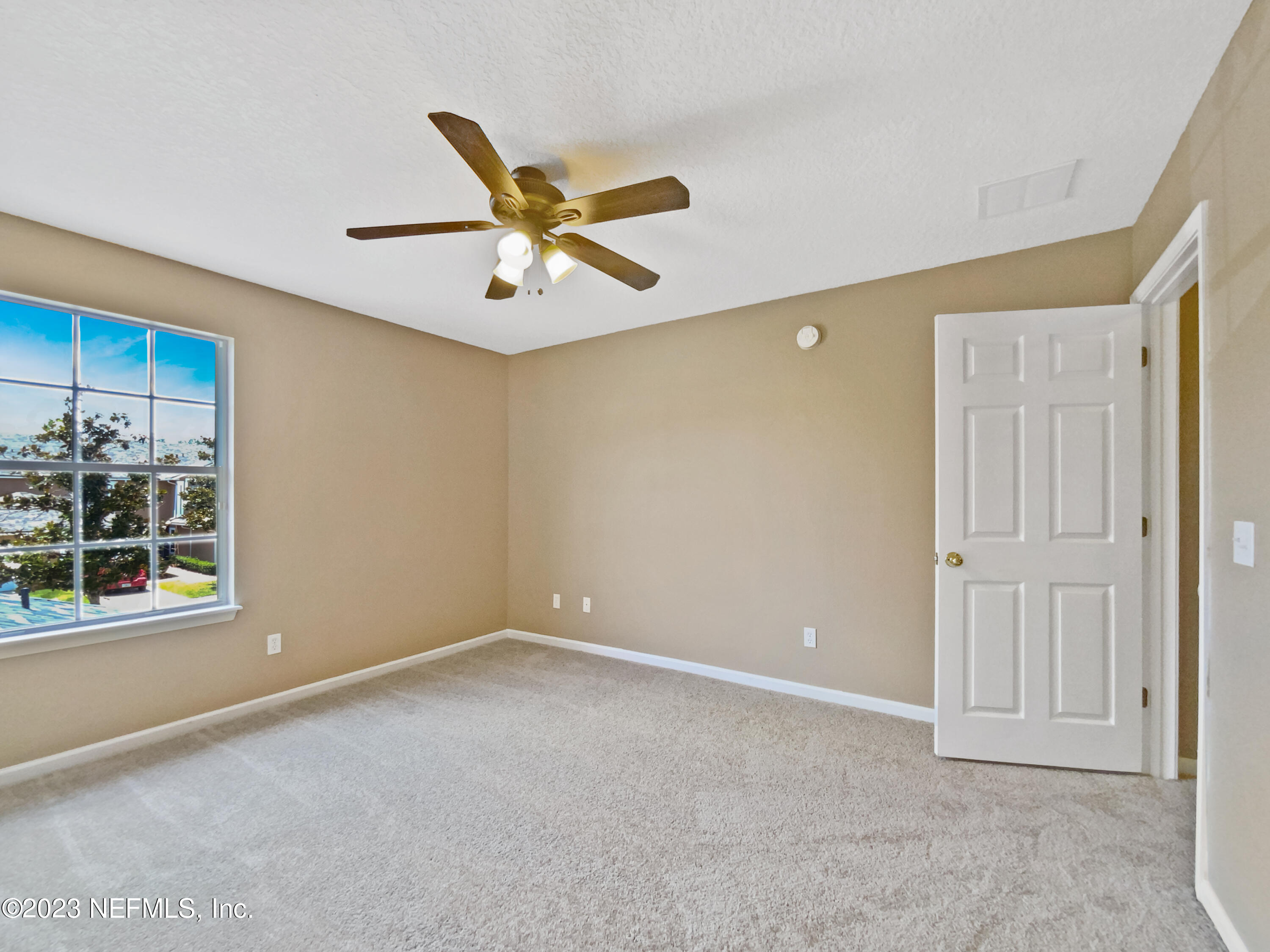 763 Scrub Jay Drive St. Augustine, FL 32092 - Photo 23 of 28 a view of an empty room with a window