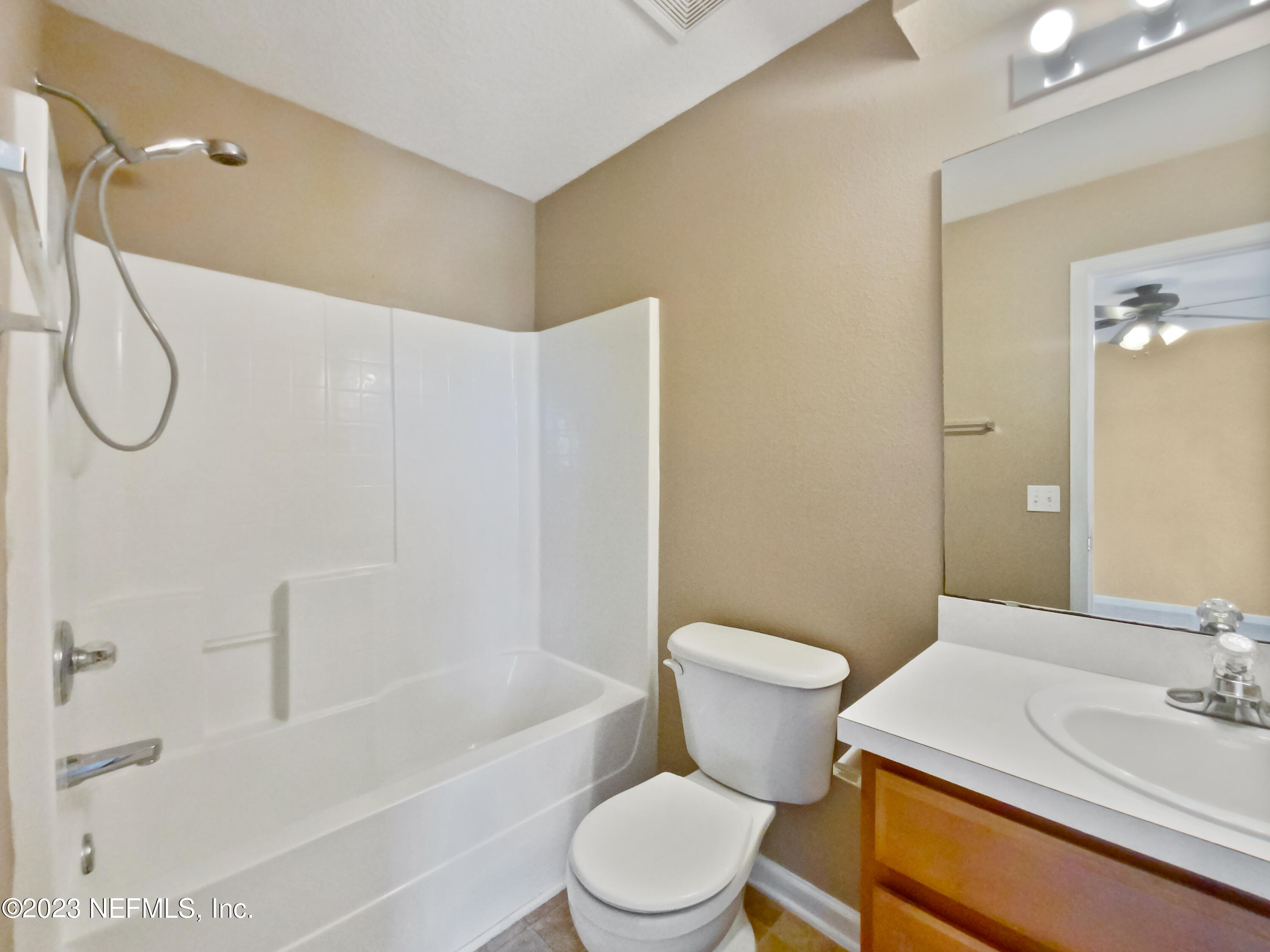 763 Scrub Jay Drive St. Augustine, FL 32092 - Photo 25 of 28 a bathroom with a sink toilet and shower