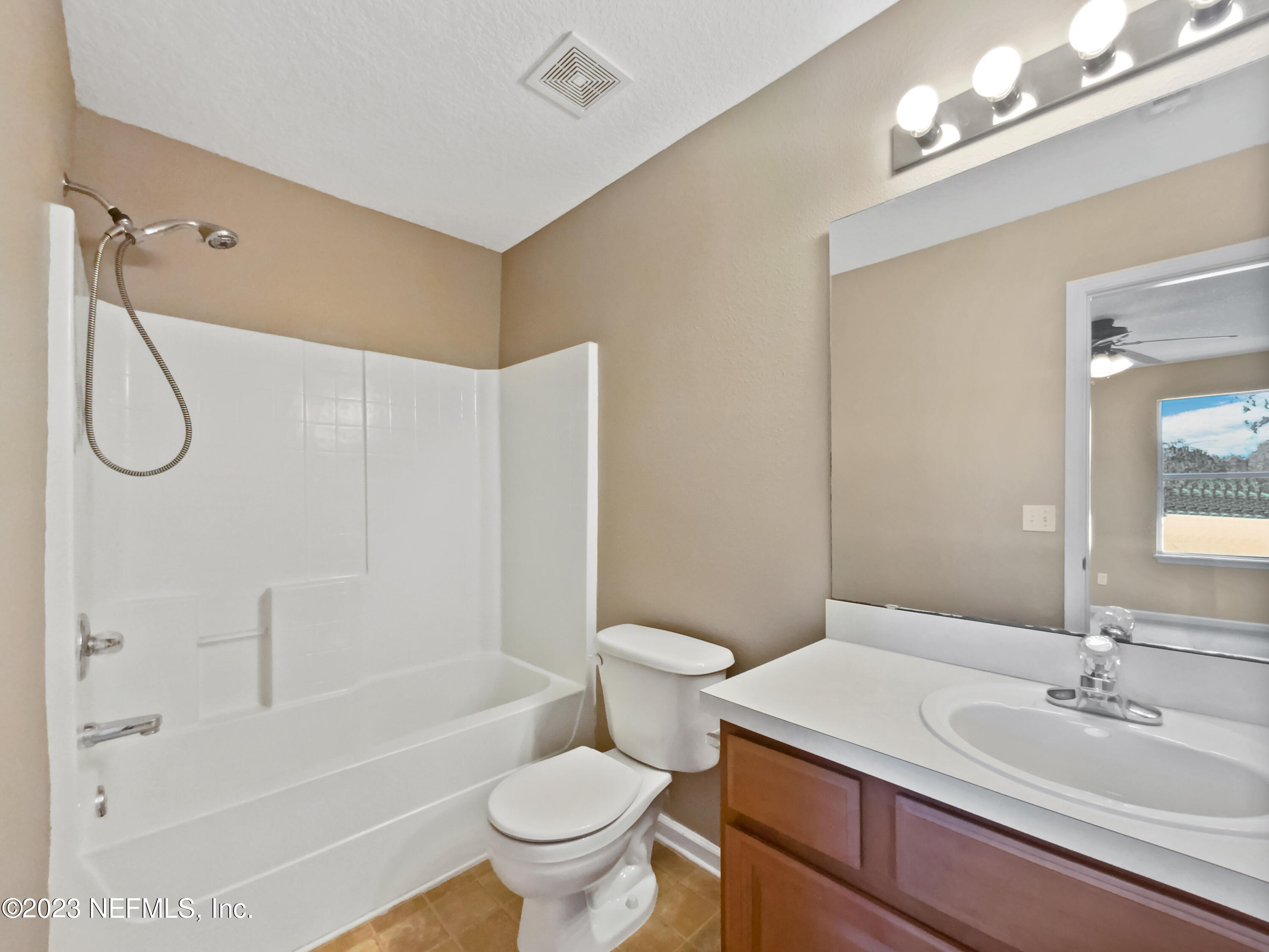 763 Scrub Jay Drive St. Augustine, FL 32092 - Photo 28 of 28 a bathroom with a sink a toilet and shower