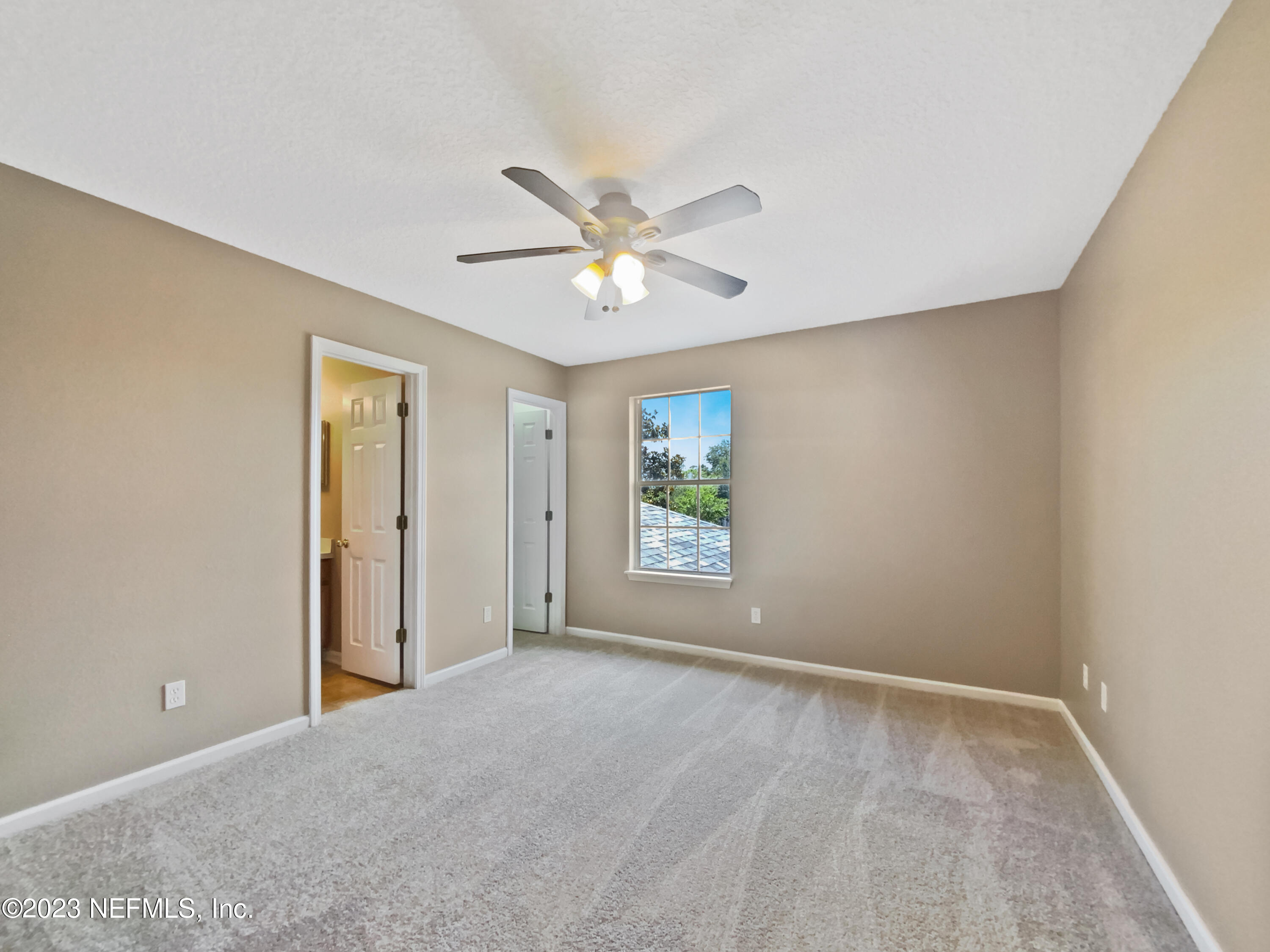 763 Scrub Jay Drive St. Augustine, FL 32092 - Photo 8 of 28 a view of an empty room with a window