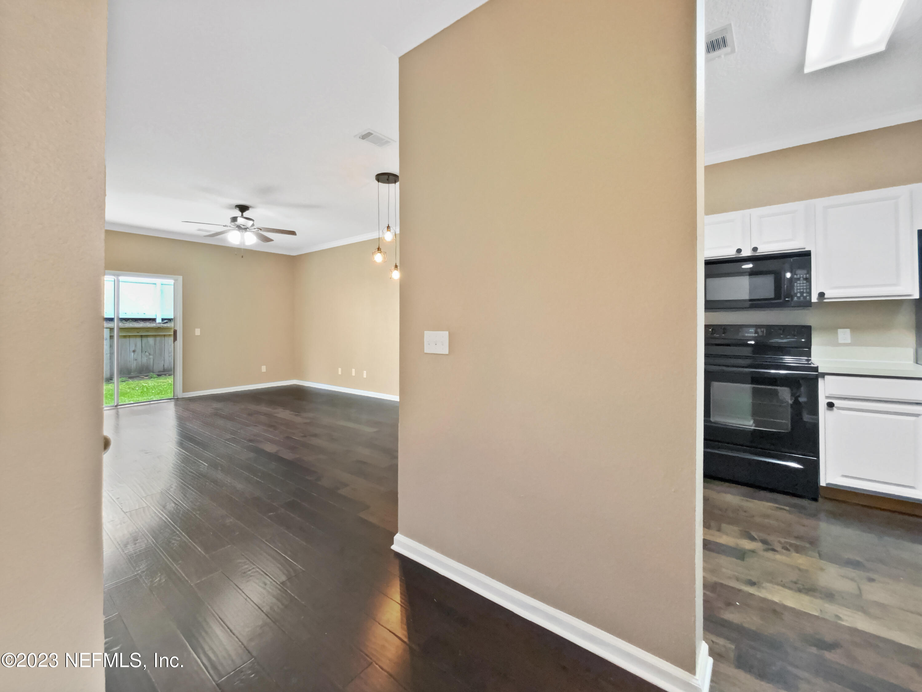 763 Scrub Jay Drive St. Augustine, FL 32092 - Photo 10 of 28 a view of a kitchen with a sink and a refrigerator