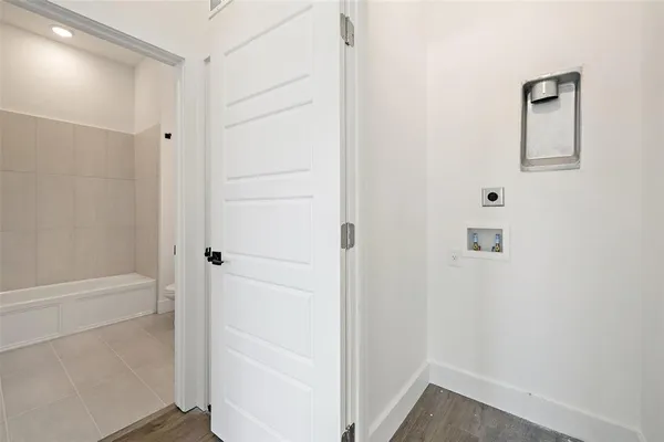 a view of a hallway with closet