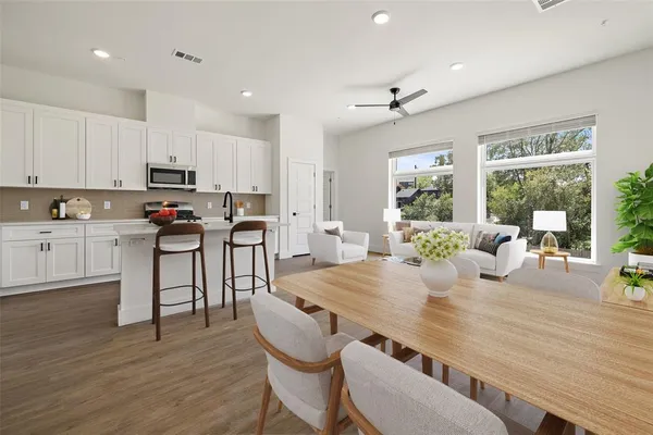 a view of a dining room with furniture and wooden floor