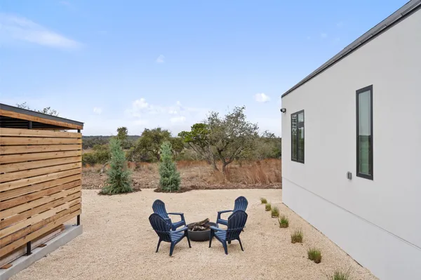 a view of backyard with seating space