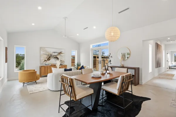 a view of a dining room with furniture window and wooden floor