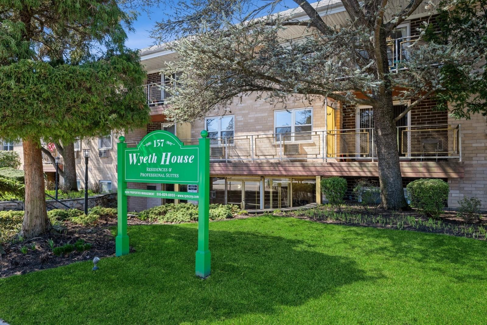 157 Hempstead Avenue, Unit B2 Lynbrook, NY 11563 - Photo 1 of 1 a front view of a house with a garden