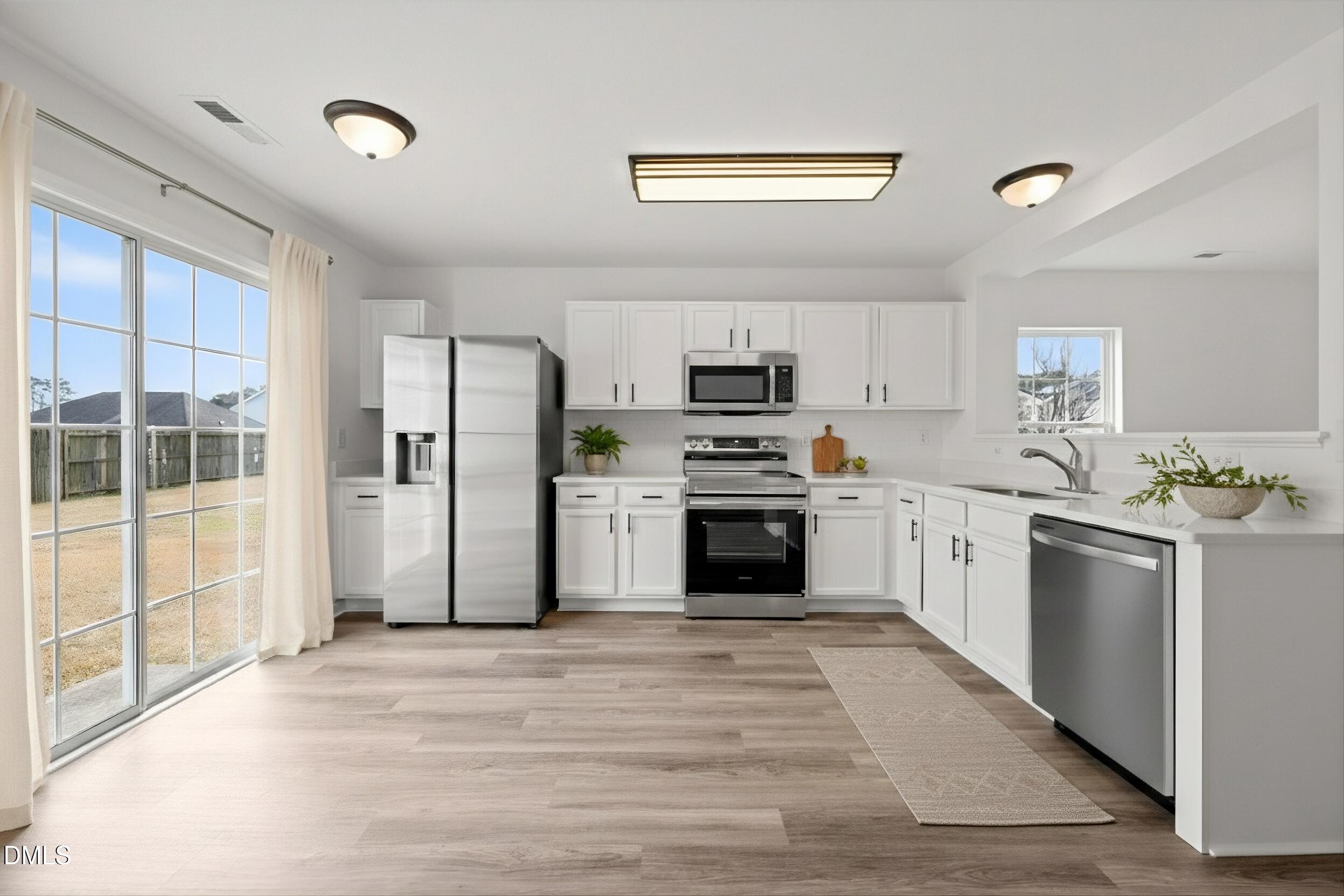 2609 Quarry Springs Road Raleigh, NC 27610 - Photo 12 of 39 This photo is virtually staged. The SS Microwave and Dishwasher are virtually staged, but will be replaced with matching Samsung appliances on 2/4/26.