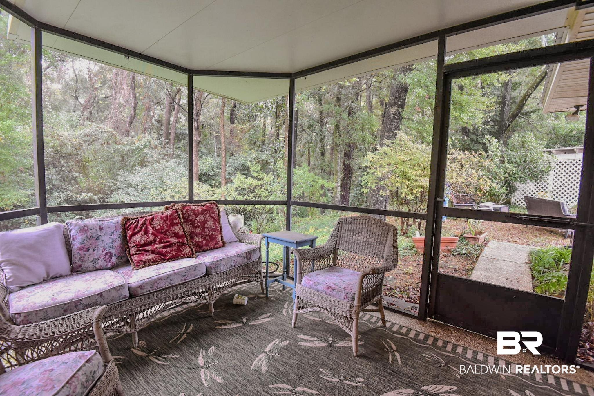 90 Paddock Drive Fairhope, AL 36532 - Photo 22 of 23 Sunroom featuring plenty of natural light and an outdoor living space