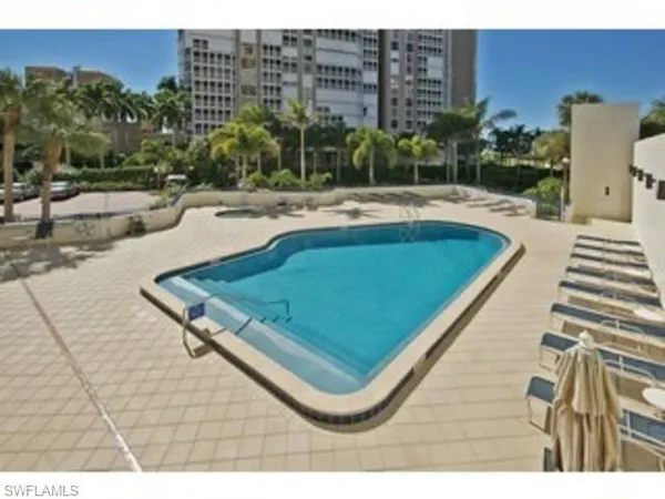 a view of a swimming pool with a terrace
