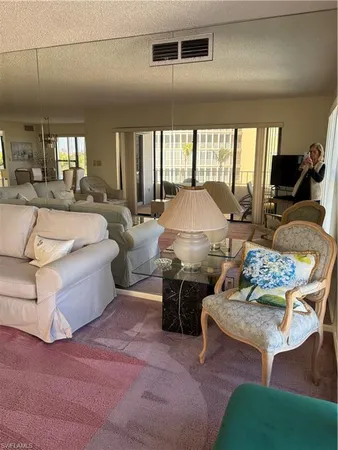 a view of a livingroom with furniture and windows